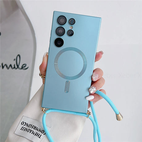 Light blue smartphone case with a magnetic ring and an attached crossbody strap.