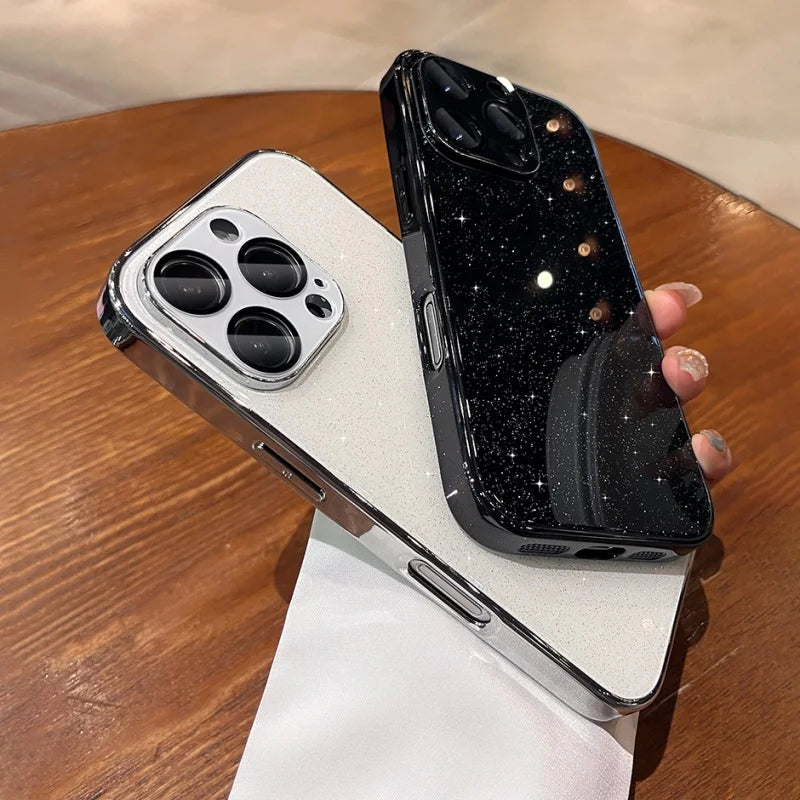 Two glitter-finish iPhone cases, one white with a silver camera bezel, and one black with scattered light reflections.