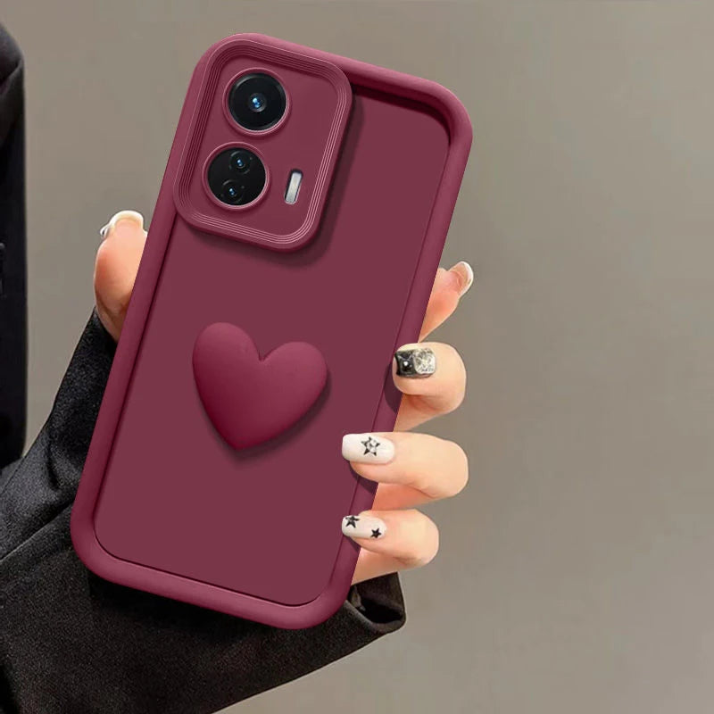 Maroon phone case with a raised heart and camera bump.
