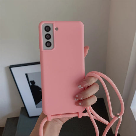 Pink smartphone with a matching lanyard case.