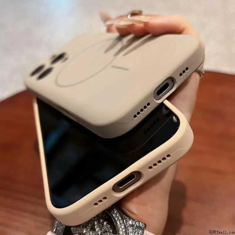 Two beige silicone phone cases, one with a subtle circular design and the other plain.