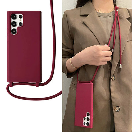 A maroon phone case with an attached lanyard.