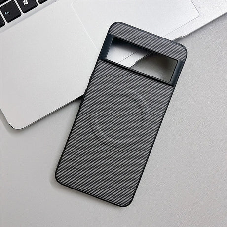 Black carbon fiber patterned phone case with a camera cutout and a visible MagSafe ring.