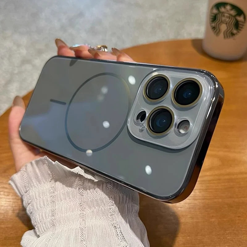 A smartphone with a transparent, dark gray case featuring a circular magnetic charging indicator and a triple-lens camera system.
