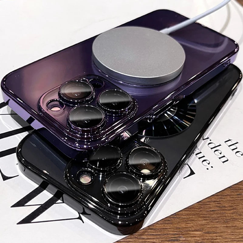 Two glossy smartphone cases, one purple and one black, with prominent camera lens protectors and a magnetic wireless charger attached to the purple case.