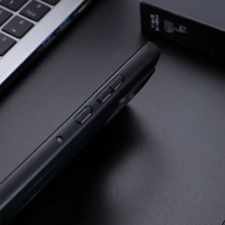 Black smartphone in a protective case with visible side buttons.