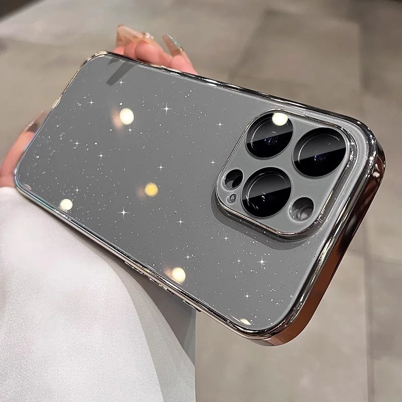 Sparkly gray smartphone with a reflective chrome bumper and a triple camera system.