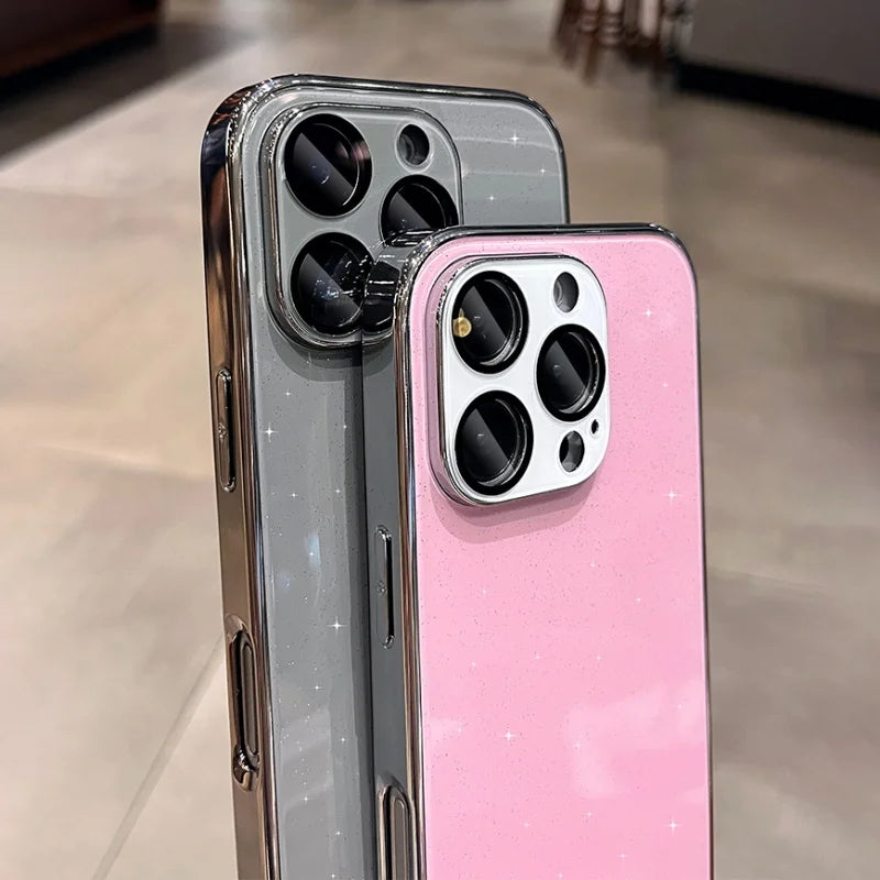 Two glittery smartphone cases, one gray and one pink, with prominent camera cutouts.