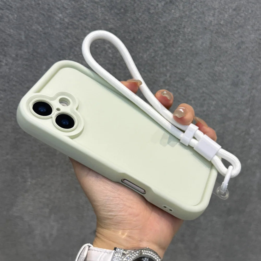 Pale green iPhone case with a white wrist strap.