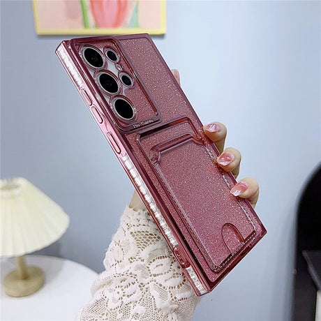 Glittery pink phone case with a camera protector and card slot.