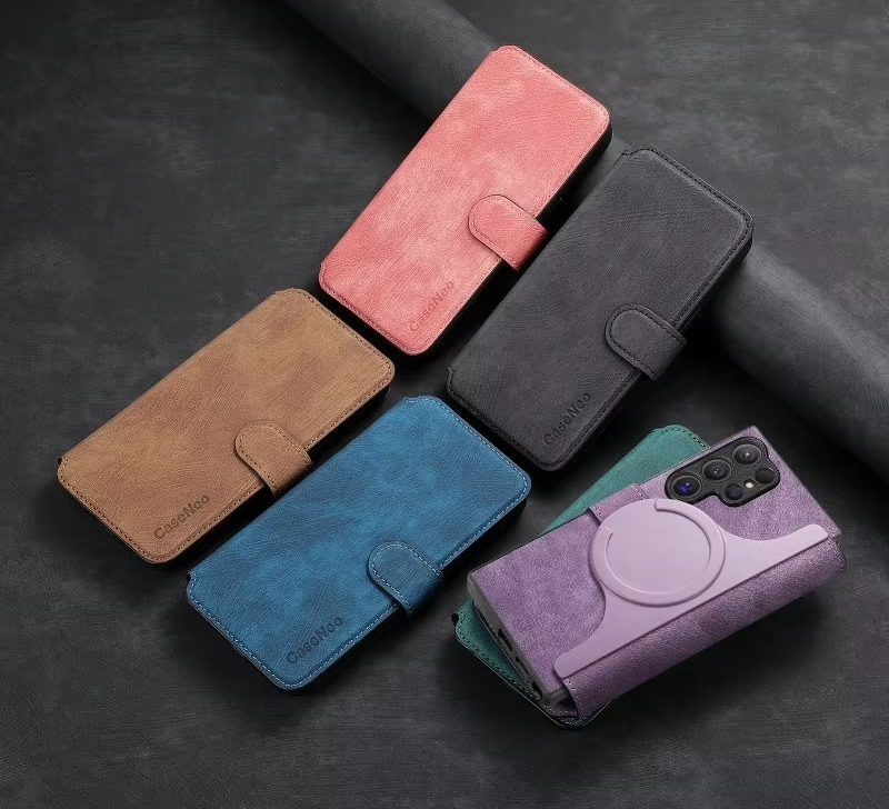 A collection of various colored smartphone cases, some with a magnetic closure and one with a circular stand attachment.