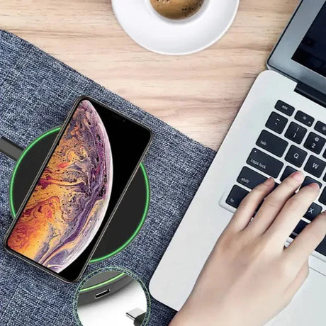 a person using a laptop and a phone
