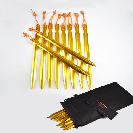 a set of gold colored pencils with a black bag