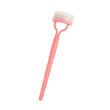 a pink plastic brush with a white handle