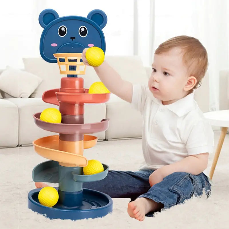 a baby playing with a stacking tower
