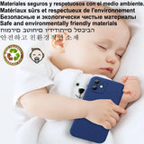 a baby sleeping on a white blanket with a cell case