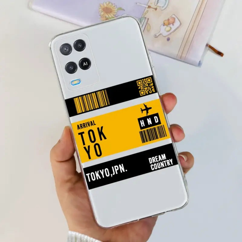 a person holding a phone case with a barcode