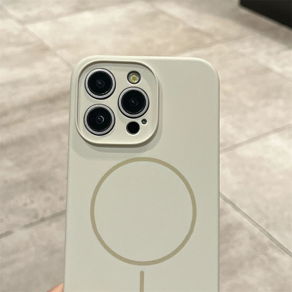 Beige iPhone with MagSafe case.