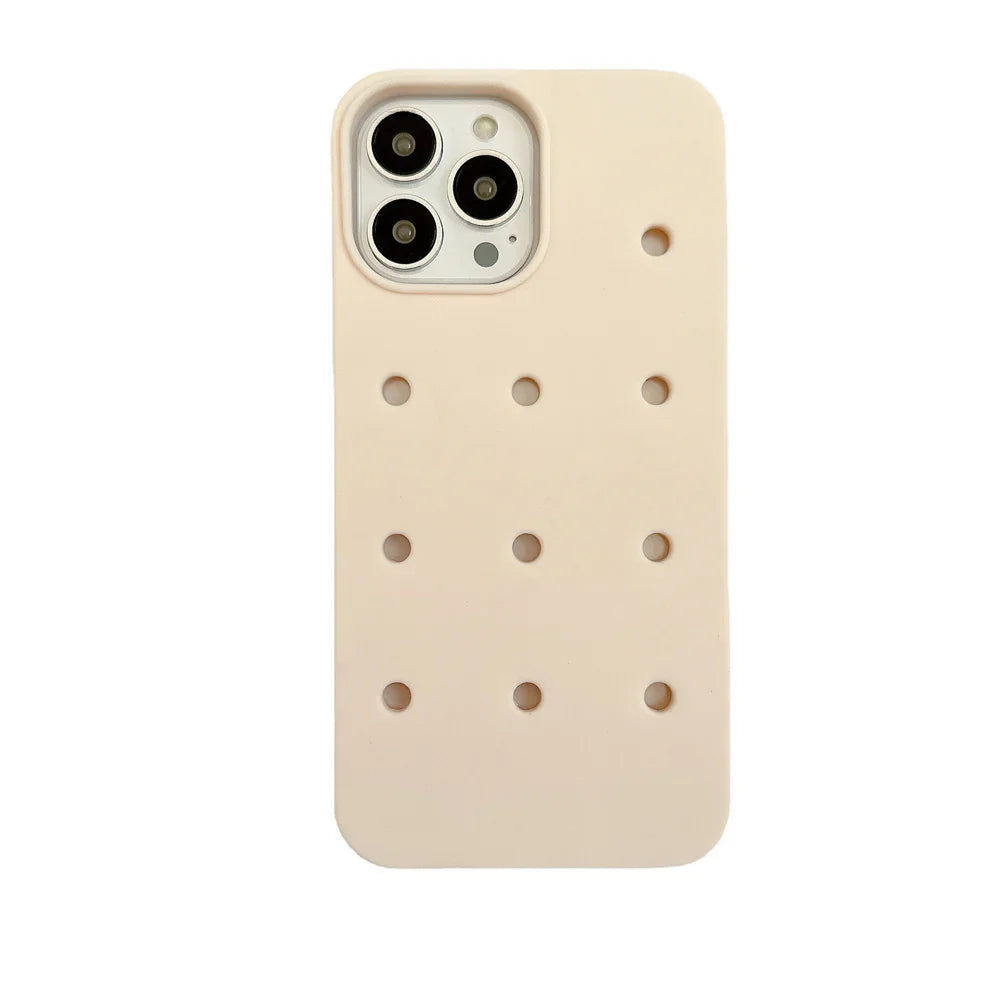 Beige phone case with circular perforations.