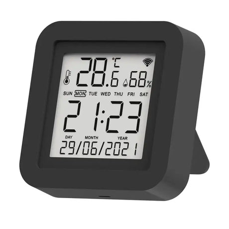 a black alarm clock with a white display