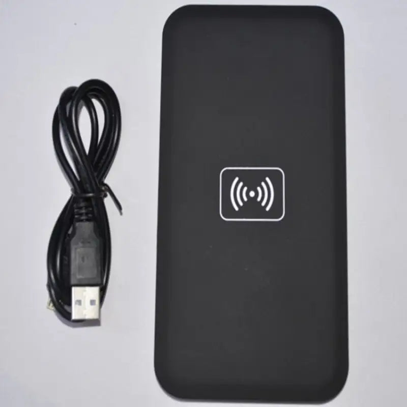 a black box with a usb and a cable