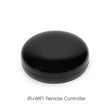 Black, glossy, circular remote controller.