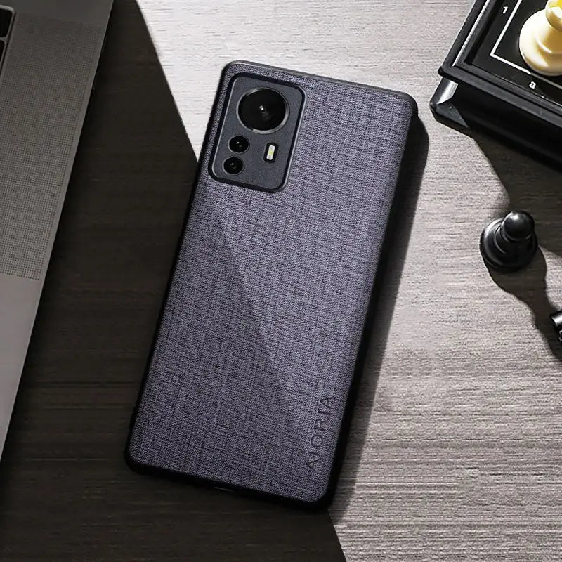 the back of a black and gray case on a desk