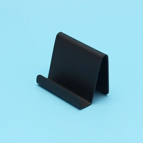 a black plastic card holder on a blue background