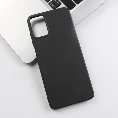 the back of a black iphone case sitting on top of a laptop