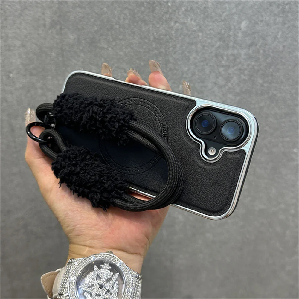 Black leather phone case with fuzzy strap.