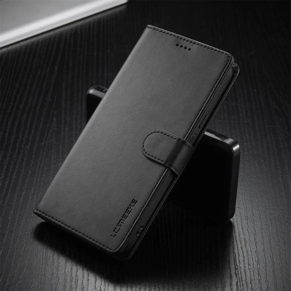 Black leather wallet-style phone case with a magnetic clasp.