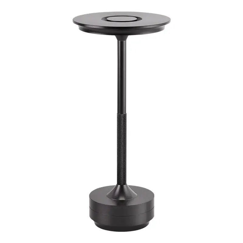 The black metal table base with a round base