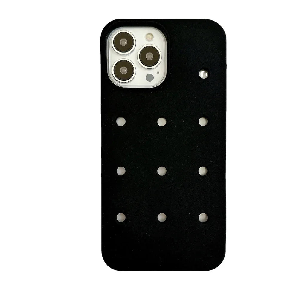 Black phone case with circular cutouts.