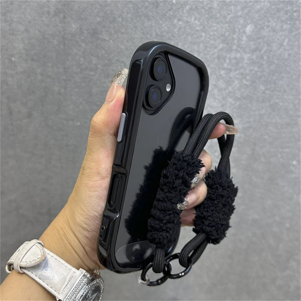 Black phone case with fuzzy strap.