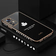 A black phone case with a gold leaf design