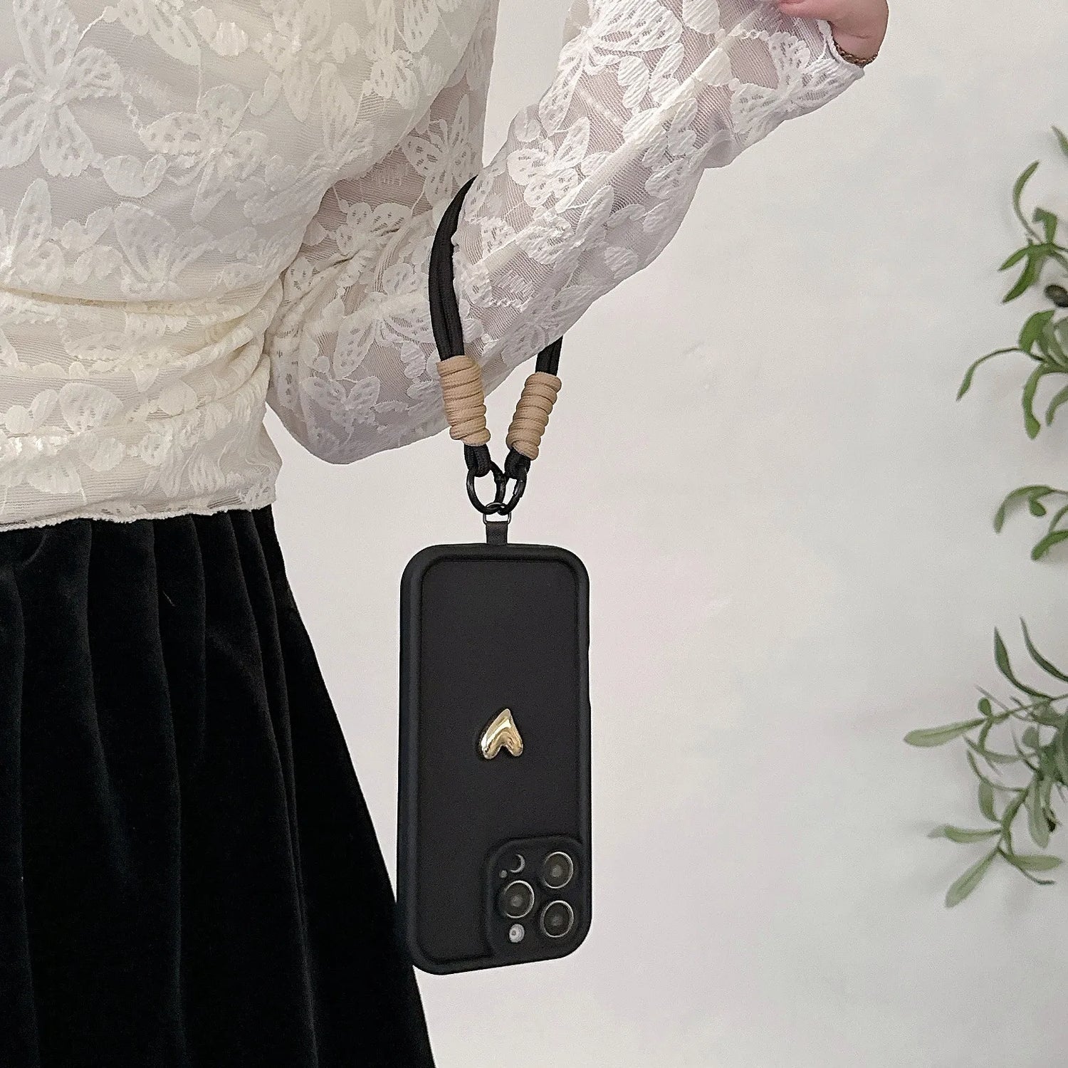 Black phone case with lanyard.