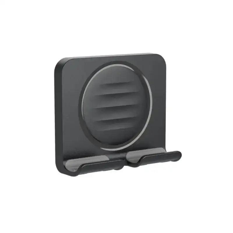 the black phone holder is attached to a white background