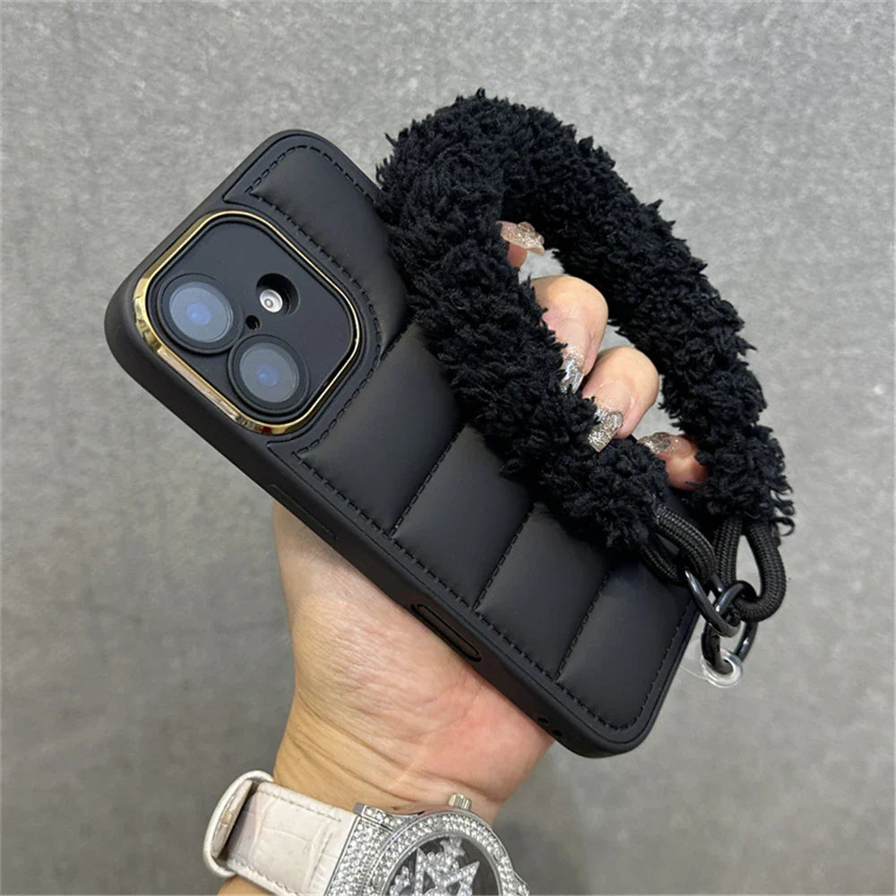 Black quilted phone case with fuzzy strap.