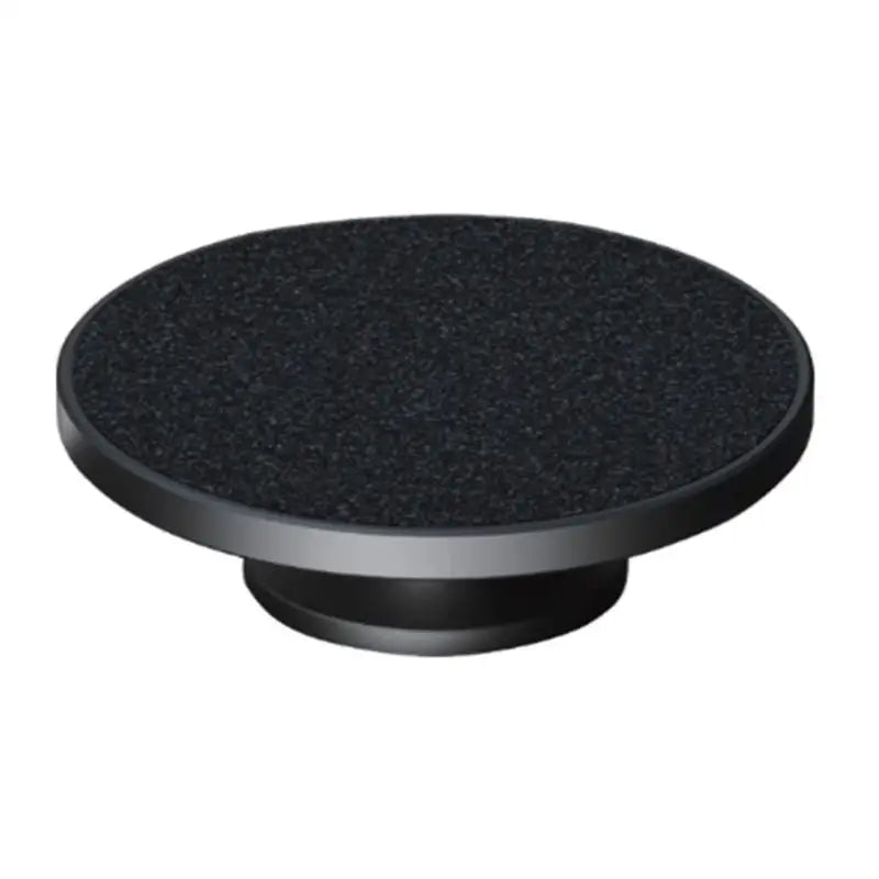 a black round knob with a black surface