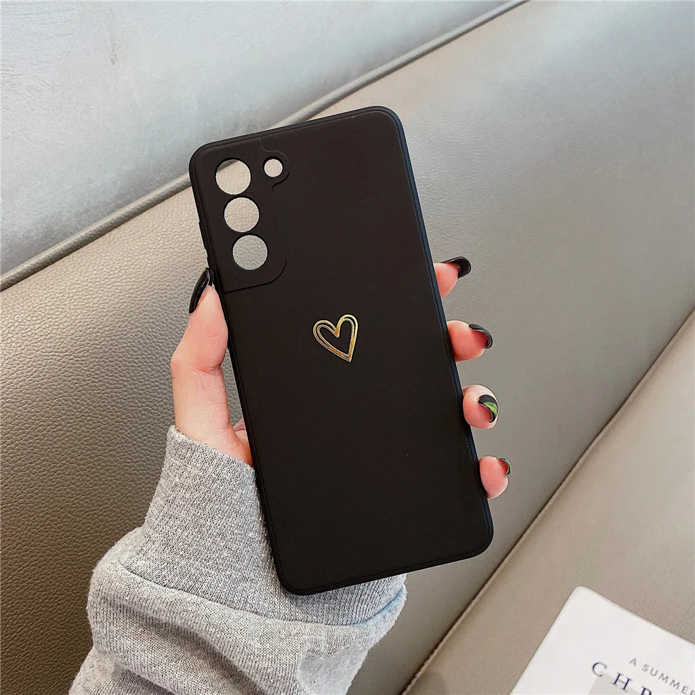 Black smartphone case with a gold heart design