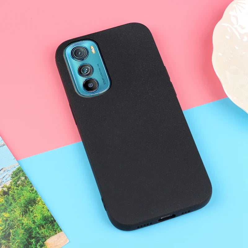 Black smartphone in a protective case.