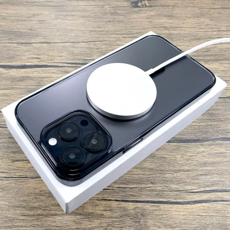 Black smartphone with wireless charger.