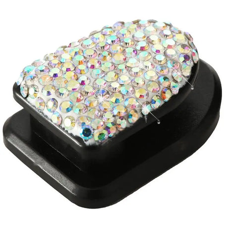 a black plastic stand with a white and multi colored crystals