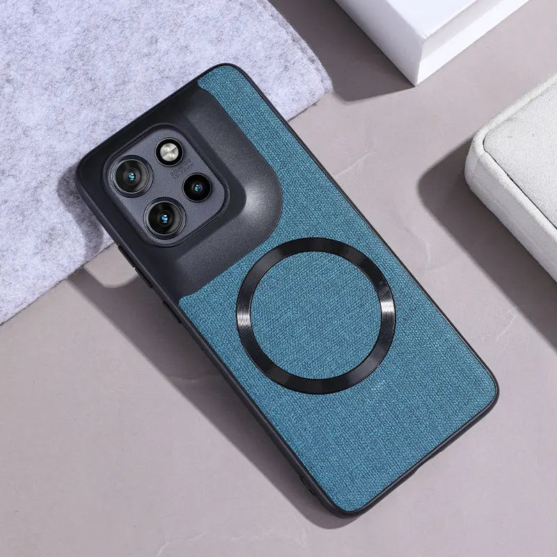 Blue fabric phone case with a black camera module and a magnetic ring.
