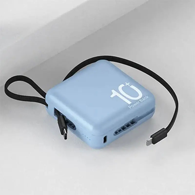 a blue power bank with a black cord