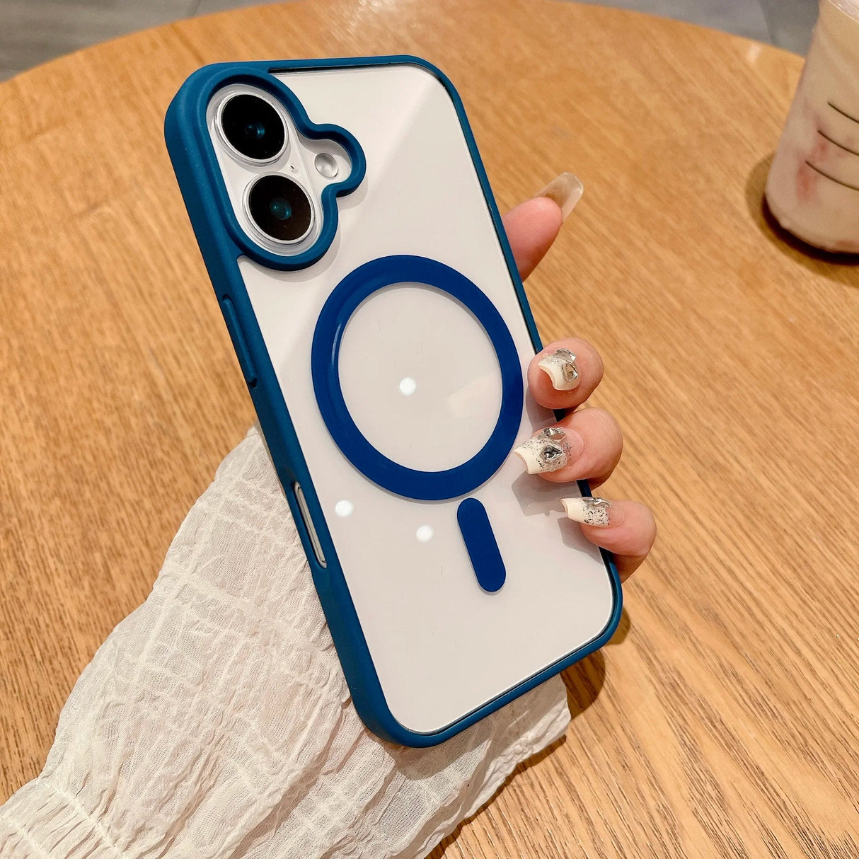 Blue-trimmed clear phone case with magnetic ring.