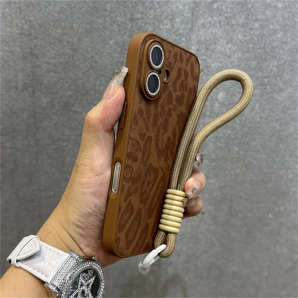 Brown leopard-print phone case with wrist strap.
