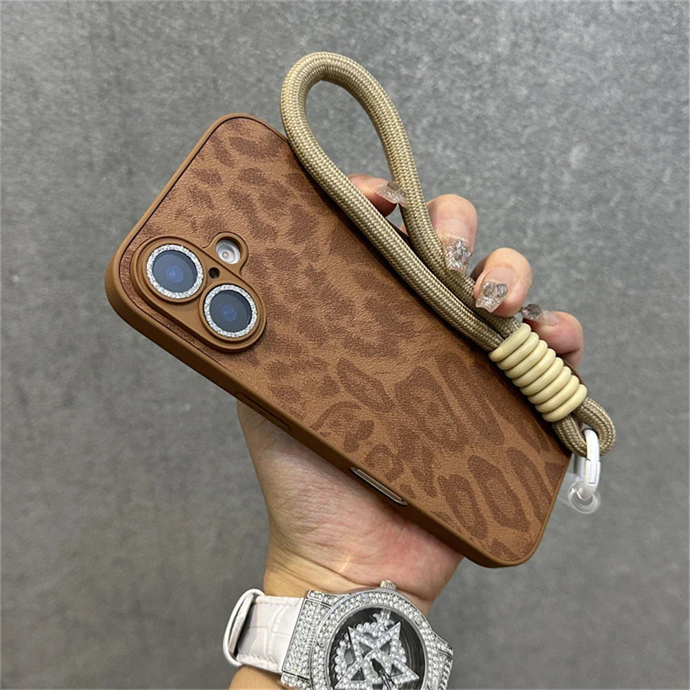 Brown leopard-print phone case with wrist strap.