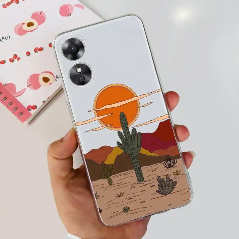 a person holding a phone case with a desert scene