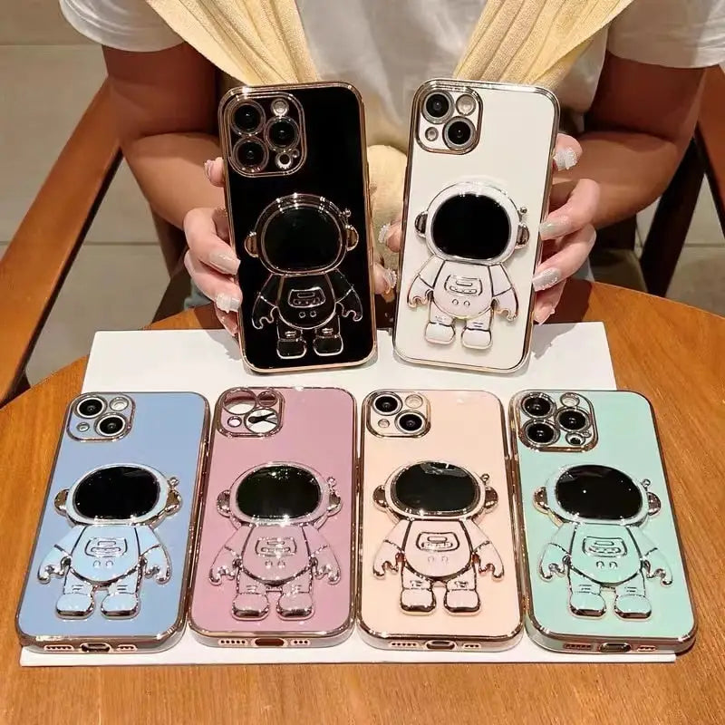 there are four different cases of cell phones with a cartoon character
